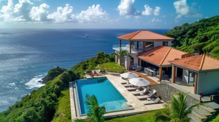 Obraz premium A large house with a pool and a view of the ocean
