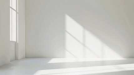 A large, empty room with a window that lets in sunlight