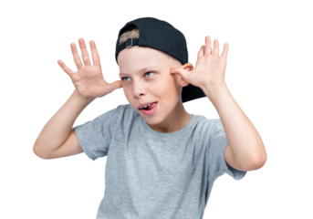 A teenage boy in a baseball cap teases and makes a face, sticking out his tongue, isolated on a transparent background png