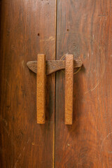 Old dark brown wooden door with lock