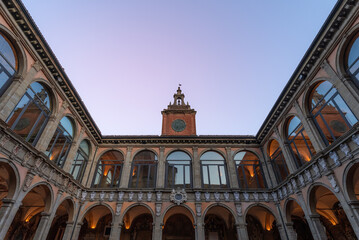 The serene dusk sky sets a picturesque backdrop for the stately entrance to Bologna prestigious...