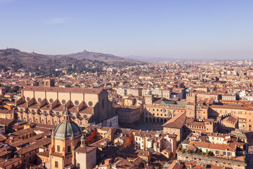 This aerial view of Bologna historic city center highlights the famous Piazza Maggiore, along with...