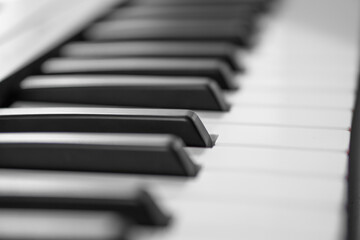 piano keys, blurred background in the distance