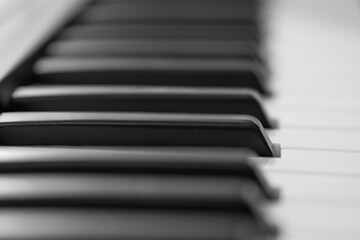 piano keys, blurred background in the distance