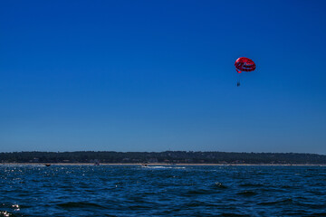 Fototapeta na wymiar Parachute, boat, sea, sky, blue, vacation, view, beauty