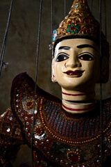 Close up of an ancient myanmar marionette hand in treaditional costume.An ancient myanmar...