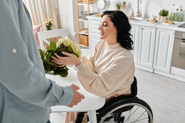 A disabled woman in a wheelchair holding a vibrant bouquet of flowers, surrounded by love in her...