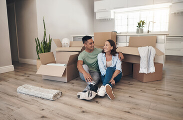 Break, couple and happy in new home with boxes for moving in, satisfied and confident with...