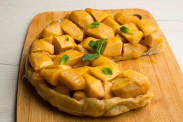 Tarte Tatin is a variant of apple pie in which the apples have been caramelized in butter and sugar before adding the dough.