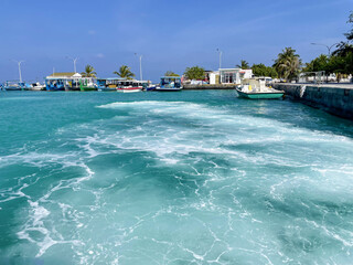 Boat station and sea ​​foam at the Maldives islands
