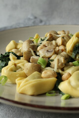 Savory Spinach and Ricotta Stuffed Tortellini in Creamy Chicken and Mushroom Sauce