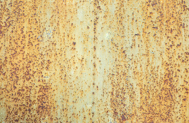 Paint peeling crackling off brown rusty metal texture background. Green paint peeling off rusty...