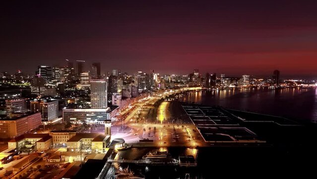 Aerial footage of downtown Luanda, Angola at night or at the end of the day.