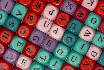 Foreground of cubes with various colorful letters