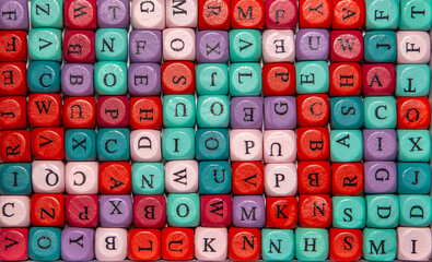 Foreground of cubes with various colorful letters