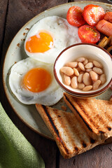 traditional breakfast with eggs salad and toast