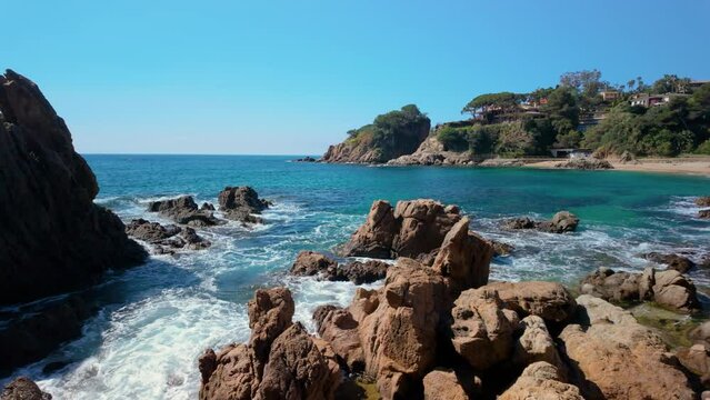 Indulge in the natural beauty of Cala San Francesc, where the azure sea meets the lush vegetation, offering a tranquil escape.
