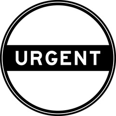 Black color round seal sticker in word urgent on white background