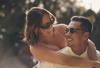 Happy, couple and piggyback with love on date in garden, park or adventure on holiday or vacation....