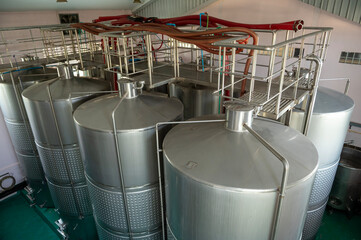 Wine fermentation tanks in modern wine factory
