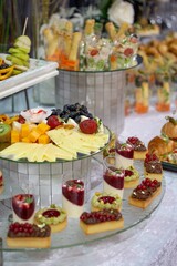 Catering Buffet with Pastries, Fruit, and Cheese on Platters and Trays