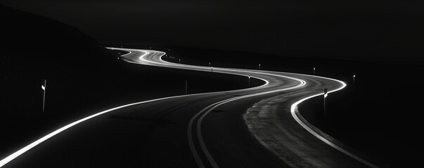 Serpentine road at night in monochrome