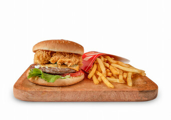 Double hamburger with fried chicken and beef burgers with fries served on wooden plate isolated on white