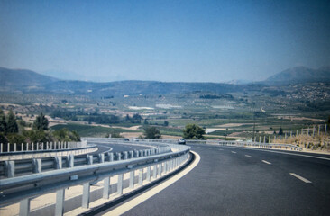 close up of the autobahn highway in Greece, with mountains in the background
