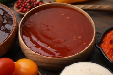 Homemade marinade in bowl on wooden table, closeup