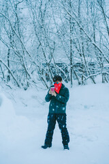 Fototapeta na wymiar young man playing in the snow In the cold season in Alaska, America