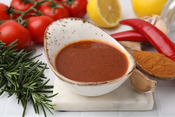 Fresh marinade and different ingredients on white table, closeup