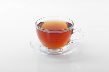 Tasty tea in cup on white background