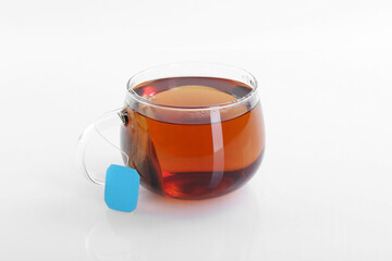 Tasty tea in cup on white background
