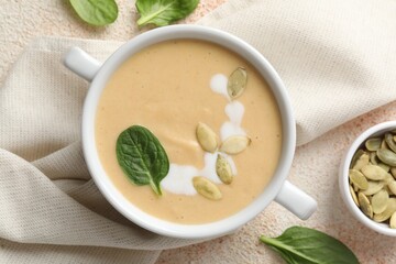 Healthy cream soup high in vegetable fats on color textured table, flat lay