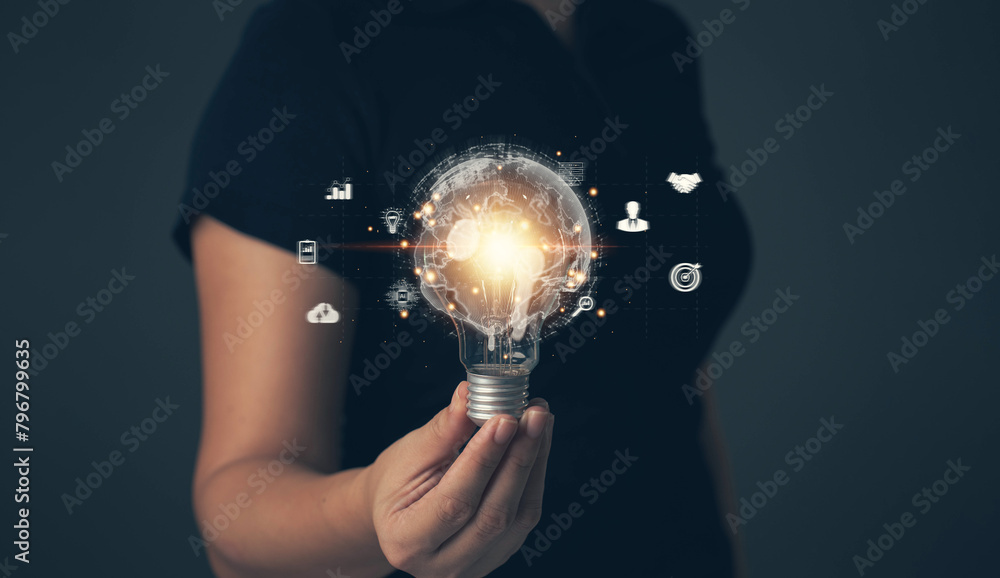 Poster light bulb in hand. the digital world. links to doing business online. searching for ideas for start