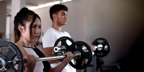 lifestyle at the gym: latin couple half plane bicep workout