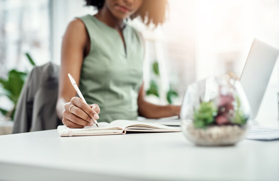 Notebook, writing and businesswoman in office, laptop and agenda or minutes from virtual meeting. Computer, video call and notes for planning in workplace, brand manager and professional employee