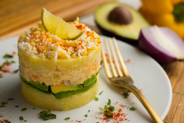 Causa Peruana. Causa Lima is a traditional starter of Peruvian cuisine made with potato, avocado, chicken or tuna.