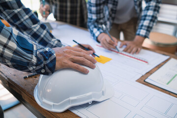 Architects and designers are talking about Construction plans before being delivered to the...