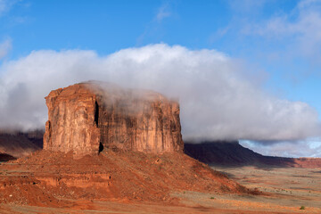 Back side of Merrick Butte in Monument Valley just after a storm where low clouds were still hanging around.