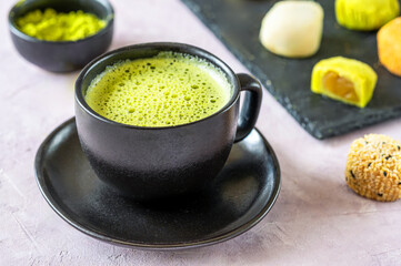 Perfectly Frothed Matcha Tea in Stylish Black Cup