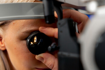 close-up in an ophthalmology clinic The girls inserted the lens and looked at the bottom of the eye