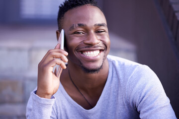 Black man, phone call and portrait in city for talking, networking and happiness on stairs. Male...