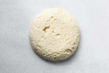 Fototapeta na wymiar Coco bread dough rising on a a marble countertop, process of making jamaican coco bread