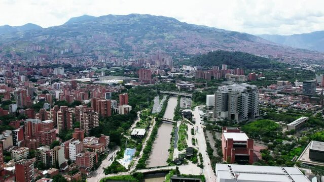 Traffic on highway next to the Medellin river.