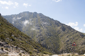 Warning sign of steep descent at the top of the Swartberg Pass, South Africa