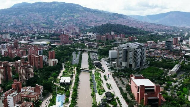 Traffic on highway next to the Medellin river.