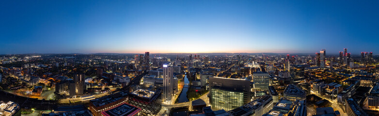 Panoramic Manchester cityscape during golden hour