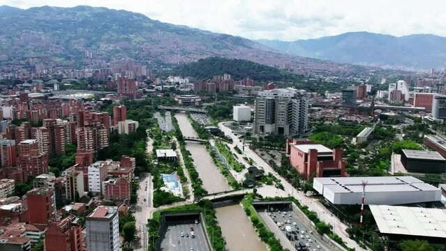 Traffic on highway next to the Medellin river.