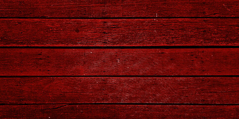 red old monochrome wooden deck flooring background showing wood grain, nails. abstract dark red timber wood oak panels used as background with blank space for design. outdoor wooden floor.